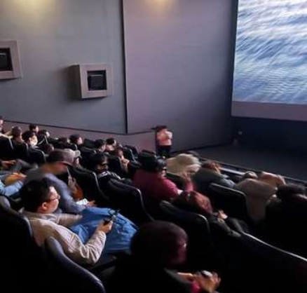 Audience wearing OWL glasses at a live performance